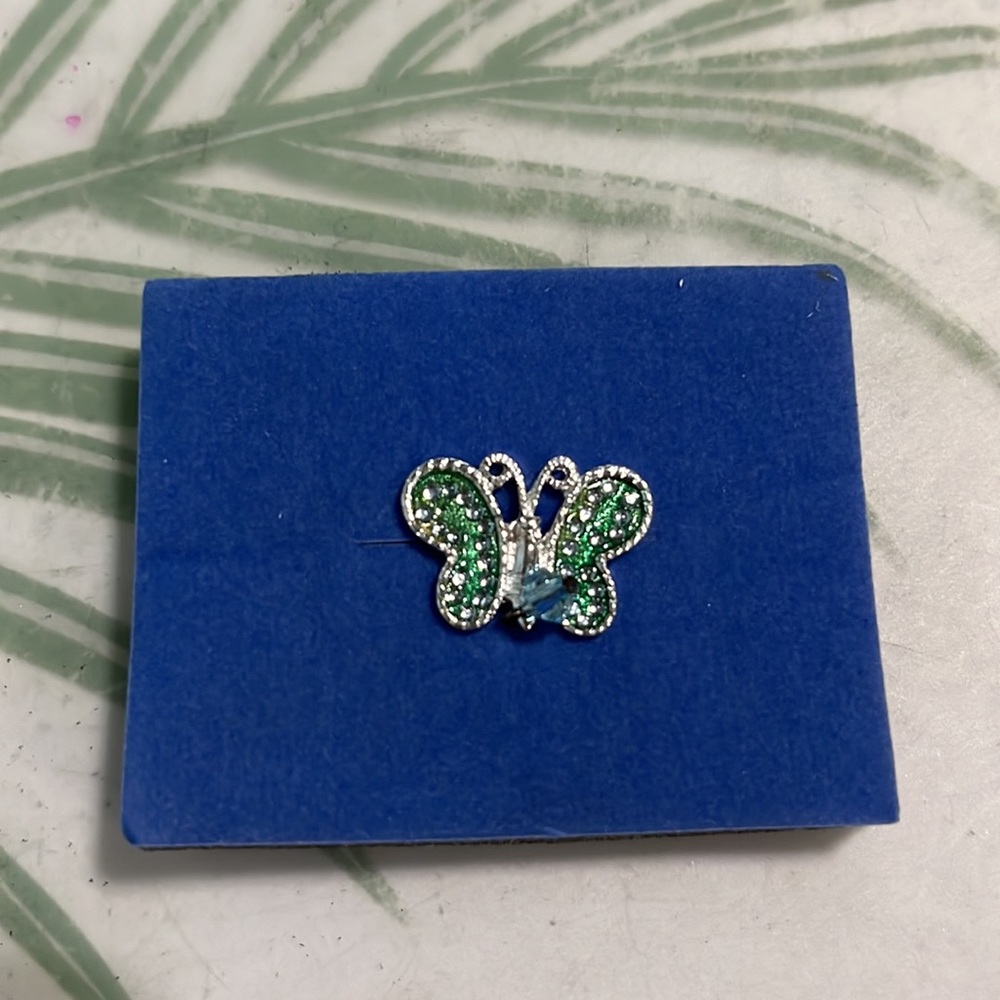 Aquamarine butterfly tac pin.